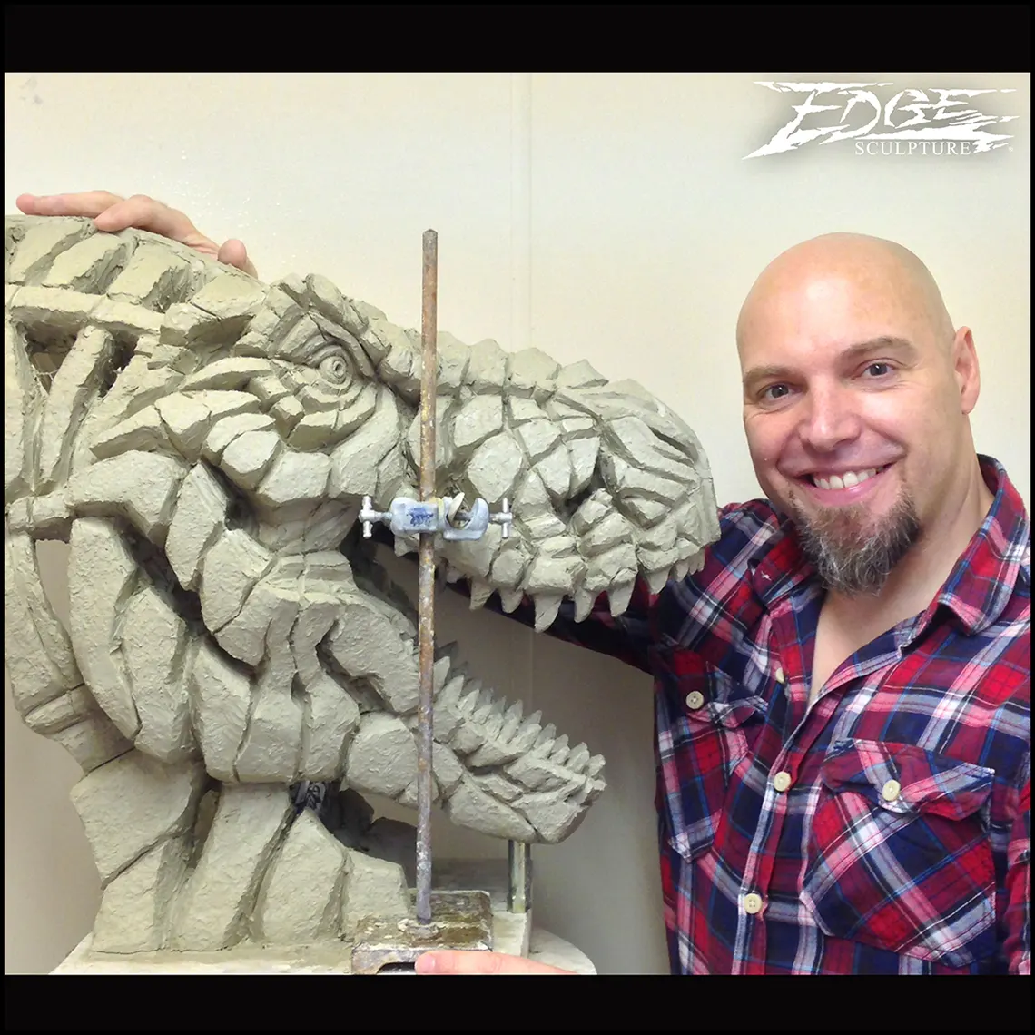 Matt with the clay sculpt of the Tyrannosaurs Rex 