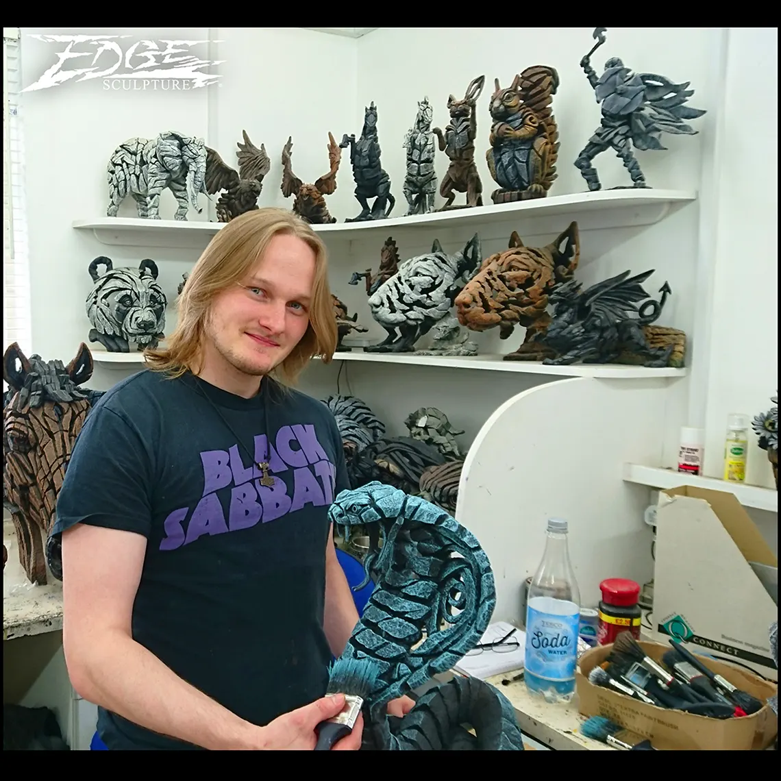 Dylan painting a cobra snake sculpt